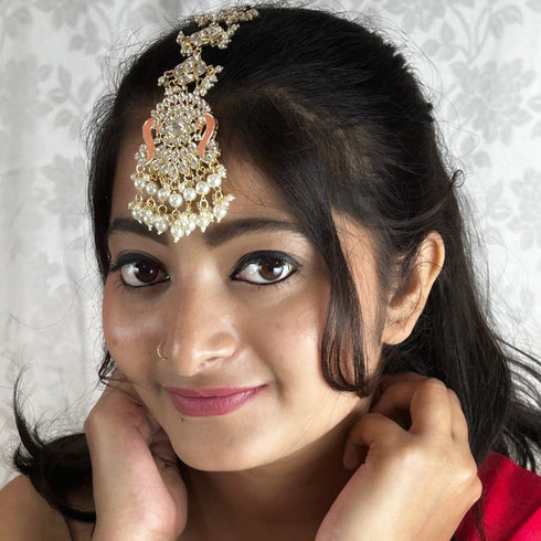 Peach Enamel Kundan Maang Tikka with Pearl Drops from Trenzify Store.