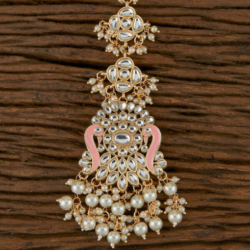 Peach Enamel Kundan Maang Tikka with Pearl Drops from Trenzify Store.