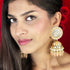Regal Floral Meenakari Kundan Jhumka Earrings from Trenzify Store.