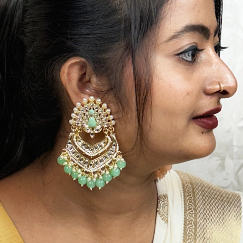 Kundan Peacock Chandbali Earrings from Trenzify Store.