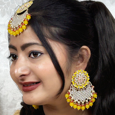 Yellow Beaded Kundan Earrings & Maang Tikka Set from Trenzify Store.