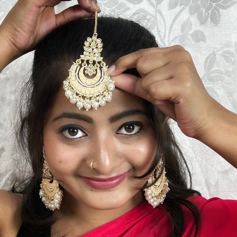 Peach Kundan Pearl Earrings & Maang Tikka Set from Trenzify Store.