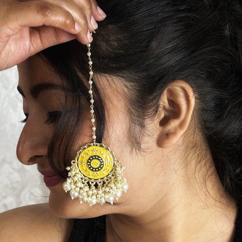 Yellow Enamel Floral Maang Tikka with Pearl Drops from Trenzify Store.