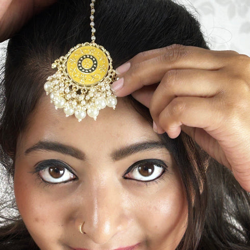 Yellow Enamel Floral Maang Tikka with Pearl Drops from Trenzify Store.