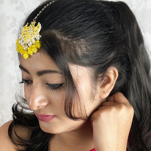 Yellow Enamel Floral Maang Tikka with Beaded Drops from Trenzify Store.
