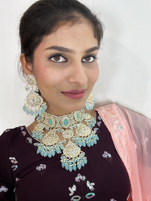 Turquoise Kundan Necklace, Earrings & Maang Tikka Set from Trenzify Store.