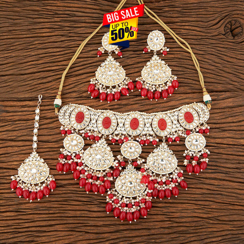 Crimson Red Kundan Necklace, Earrings & Maang Tikka Set from Trenzify Store.