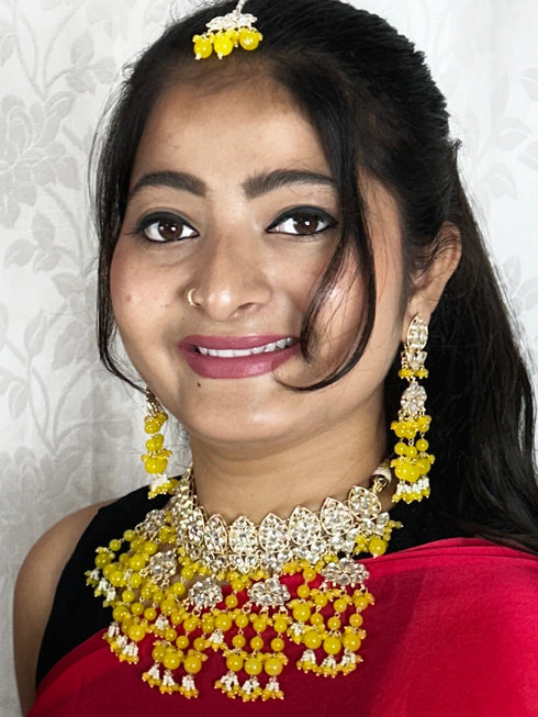 Yellow Kundan Necklace, Earrings & Maang Tikka Set from Trenzify Store.