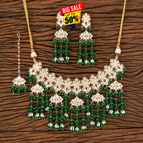 Green Kundan Necklace, Earrings & Maang Tikka Set from Trenzify Store.