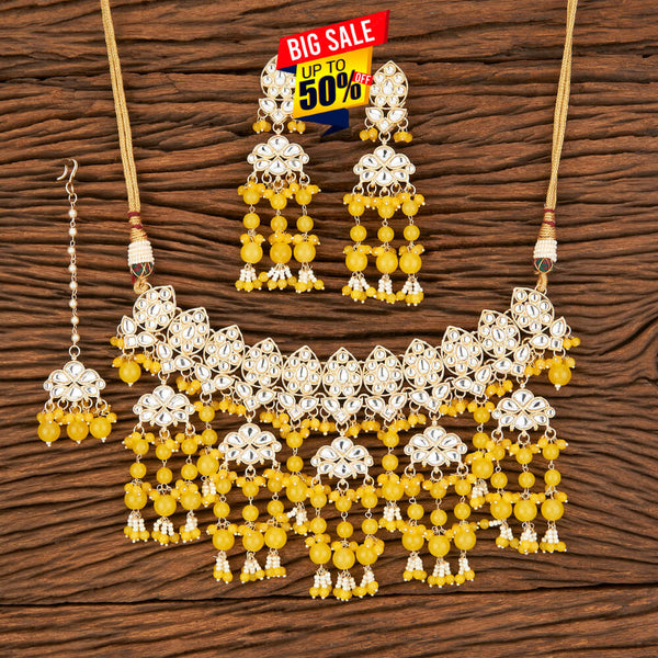 Yellow Kundan Necklace, Earrings & Maang Tikka Set from Trenzify Store.