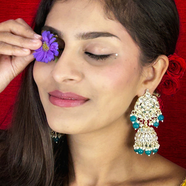 Elegant Kundan Jhumka Earrings from Trenzify Store.