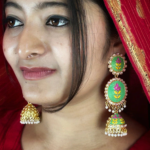 Vibrant Bloom Meenakari Jhumka Earrings from Trenzify Store.
