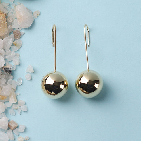 Golden ball drop earrings with hook design, anti-tarnish minimal chic jewelry from Trenzify Store.