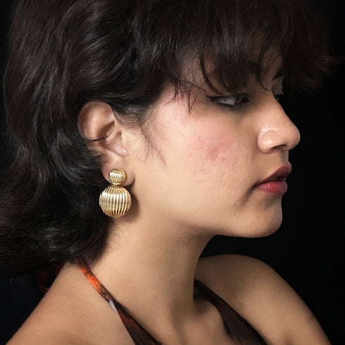 Golden double dome anti-tarnish earrings with ribbed texture, bold statement jewelry from Trenzify Store.