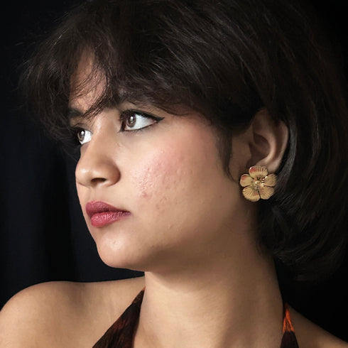 Textured Gold-Tone Floral Stud Earrings from Trenzify Store.