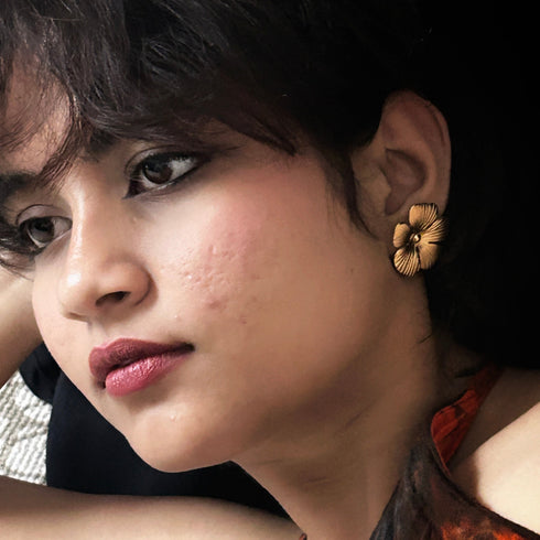Textured Gold-Tone Floral Stud Earrings from Trenzify Store.