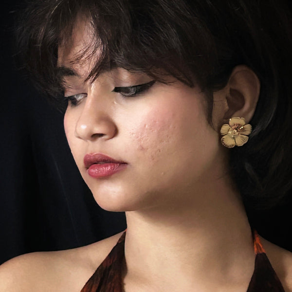 Textured Gold-Tone Floral Stud Earrings from Trenzify Store.