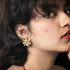Radiant Daisy-Shaped Gold-Tone Stud Earrings from Trenzify Store.