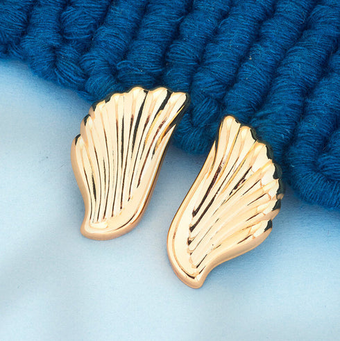 Golden wing-shaped anti-tarnish earrings with feather texture, elegant jewelry for women from Trenzify Store.