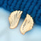 Golden wing-shaped anti-tarnish earrings with feather texture, elegant jewelry for women from Trenzify Store.