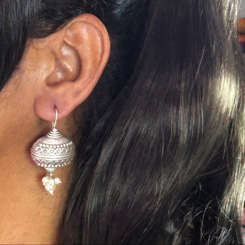 Antique Oxidized Silver Dome Jhumka Earrings with Pearl Drops from Trenzify Store.