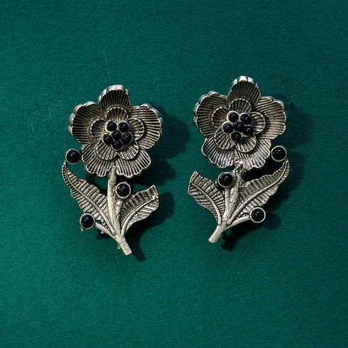 Vintage-style floral earrings with black bead accents on silver-tone metal. From Trenzify Store.