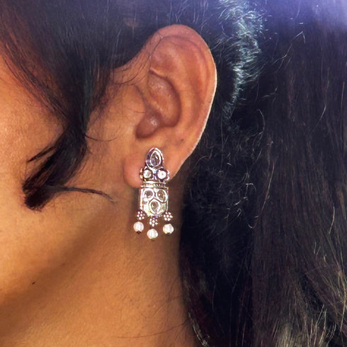 Silver earrings with pink gemstones and pearl accents, featuring a beautifully ornate design. From Trenzify Store.