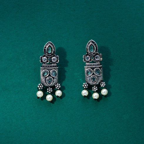 Silver earrings with intricate gemstone detailing, featuring pearl accents and a traditional design. From Trenzify Store.