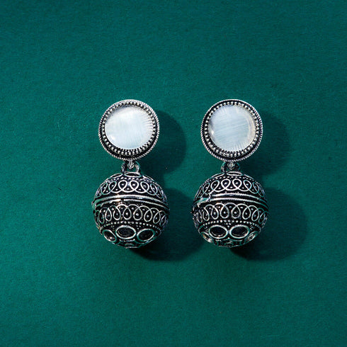 Silver earrings with an ornate design, featuring a round white stone and intricate detailing for a vintage-inspired look. From Trenzify Store.