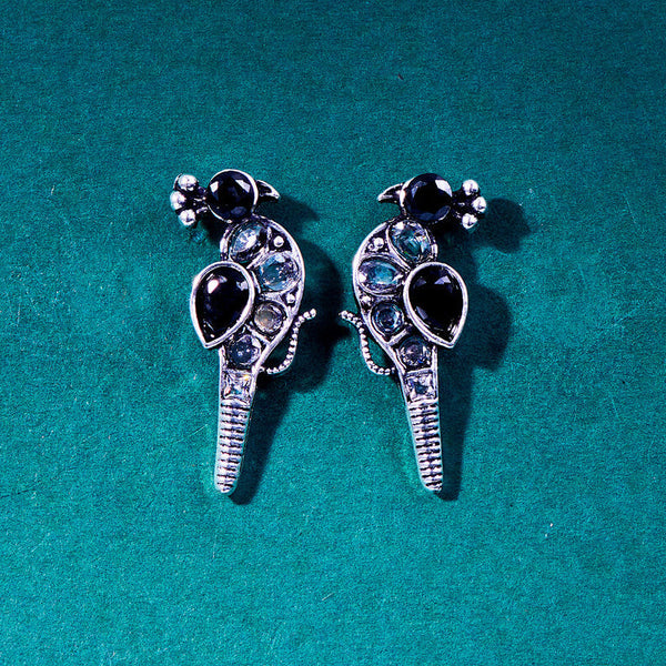 Silver peacock-shaped earrings with striking black and clear gemstones, featuring a sleek, modern bird design. From Trenzify Store.