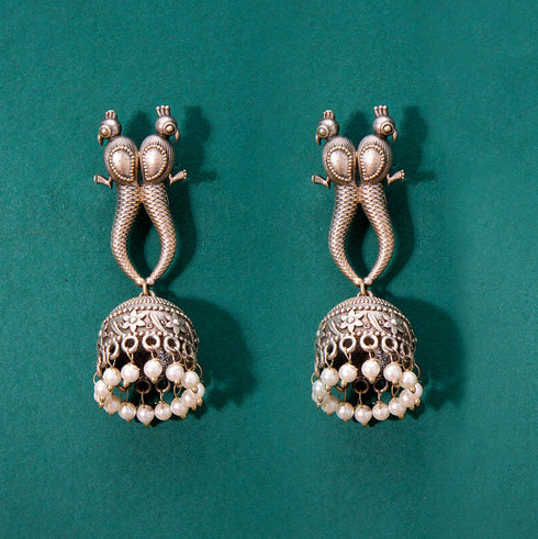 Antique Twin Peacock Jhumka Earrings with Pearl Drops from Trenzify Store.