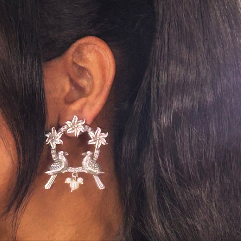 Antique Silver Bird & Floral Hoop Earrings from Trenzify Store.