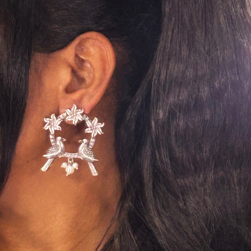 Antique Silver Bird & Floral Hoop Earrings from Trenzify Store.