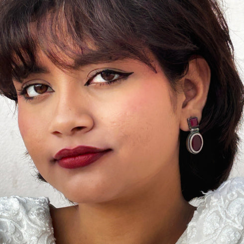 Vintage-style dangle earrings with deep ruby red square and oval gemstones set in oxidized silver. Elegant and timeless design for evening wear. Trenzify Store