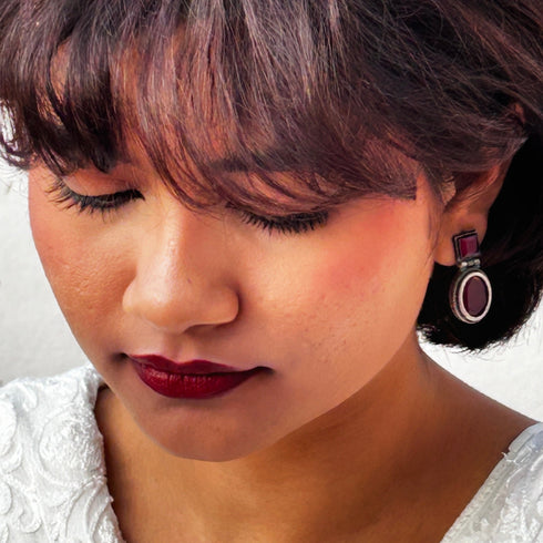 Vintage-style dangle earrings with deep ruby red square and oval gemstones set in oxidized silver. Elegant and timeless design for evening wear. Trenzify Store