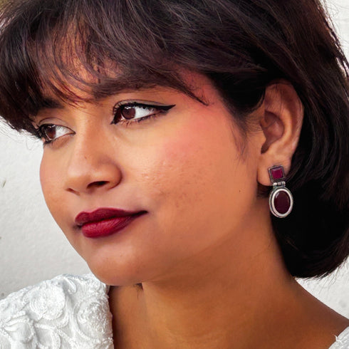 Vintage-style dangle earrings with deep ruby red square and oval gemstones set in oxidized silver. Elegant and timeless design for evening wear. Trenzify Store