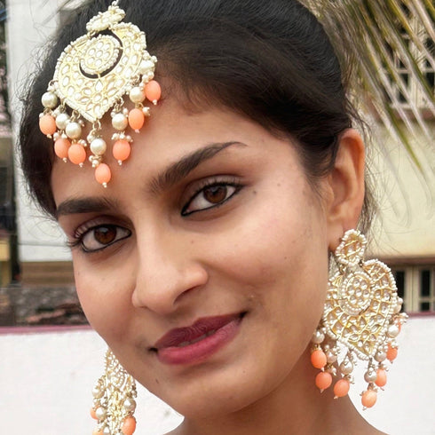 Peach Beaded Kundan Earrings & Maang Tikka Set from Trenzify Store.