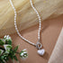 Pearl chain necklace with heart charm and silver polish finish from Trenzify Store