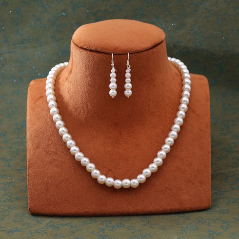 Long pearl necklace set with matching drop earrings from Trenzify Store