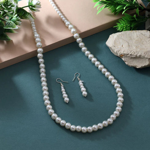 Long pearl necklace set with matching drop earrings from Trenzify Store