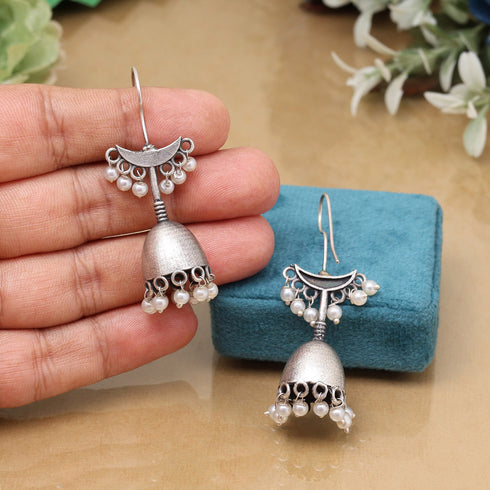 Oxidized jhumka earrings with crescent top and dome base, adorned with pearl drops – traditional ethnic jewelry design from Trenzify Store
