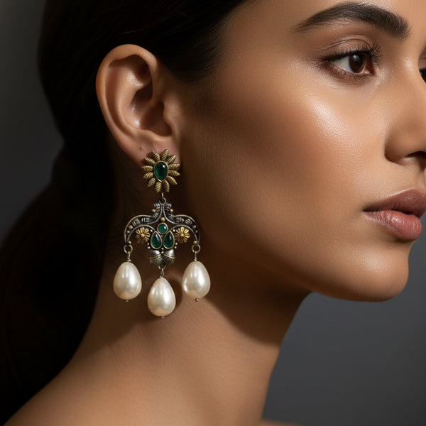 Oxidized floral pearl drop earrings with green stones, antique silver finish and triple pearl hanging from Trenzify Store