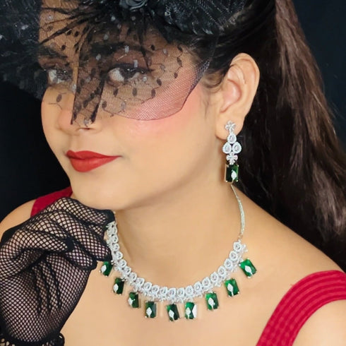 Model wearing American Diamond (CZ) green rectangular stone necklace set with matching earrings – imitation jewelry from Trenzify Store.