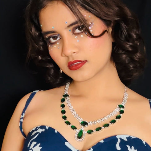 Model wearing American Diamond (CZ) green stone necklace set with matching earrings – imitation jewelry from Trenzify Store.