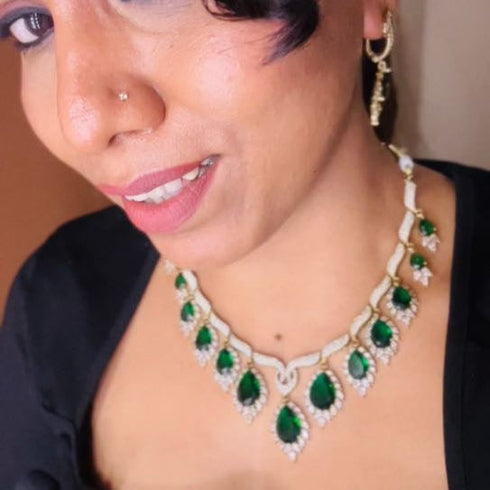 Model wearing American Diamond (CZ) green teardrop necklace set with matching earrings β imitation jewelry from Trenzify Store.