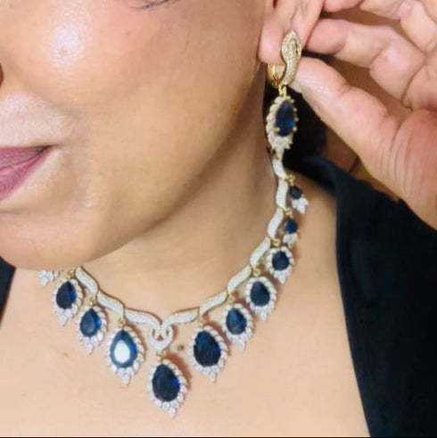 Model wearing American Diamond (CZ) blue teardrop necklace set with matching earrings – imitation jewelry from Trenzify Store.
