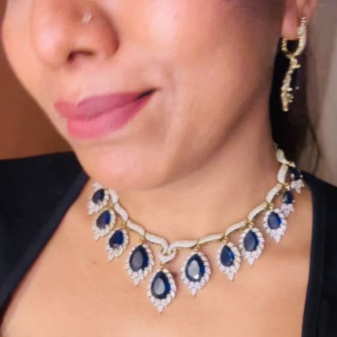 Model wearing American Diamond (CZ) blue teardrop necklace set with matching earrings – imitation jewelry from Trenzify Store.