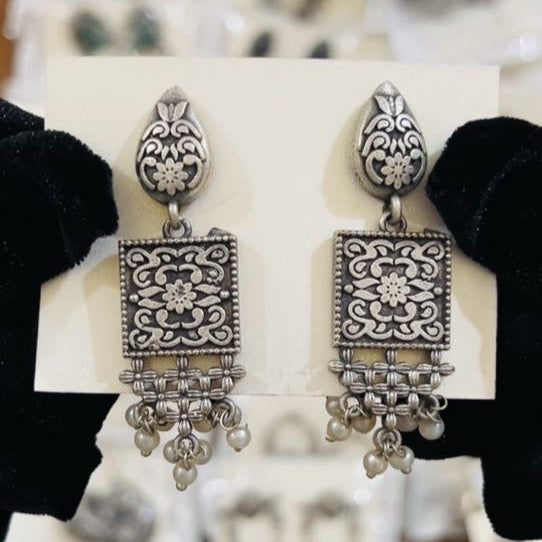 Handcrafted oxidized earrings with square floral design, lattice base, and pearl drop accents – traditional ethnic jewelry from Trenzify Store