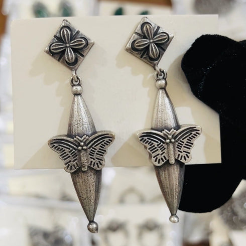 Handcrafted oxidized earrings with butterfly motif, cone-shaped drop, and floral stud top – ethnic silver jewelry - Trenzify Store