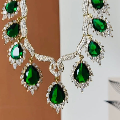Model wearing American Diamond (CZ) green teardrop necklace set with matching earrings β imitation jewelry from Trenzify Store.